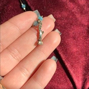Statue of Liberty necklace.